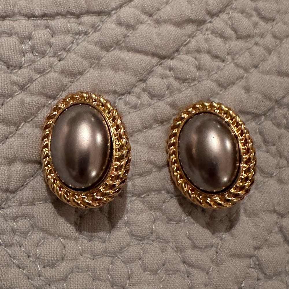 Elegant gold and silver gray center oval clip on earrings.